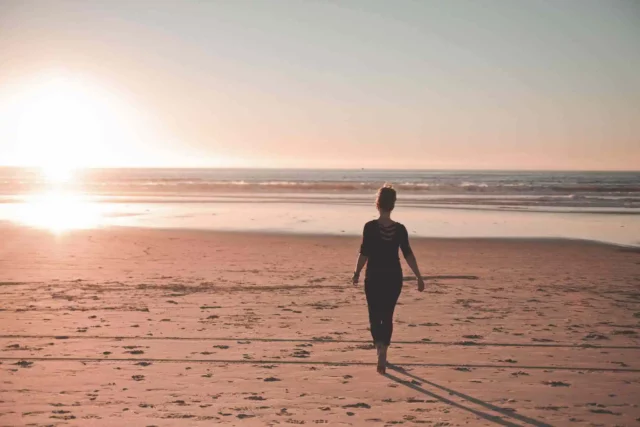 Woman on beach with Fibromyalgia
